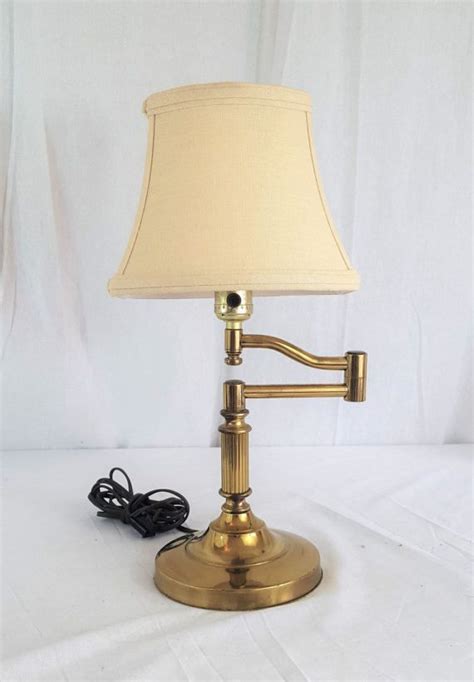 A Lamp That Is Sitting On Top Of A White Surface With A Cord Attached To It