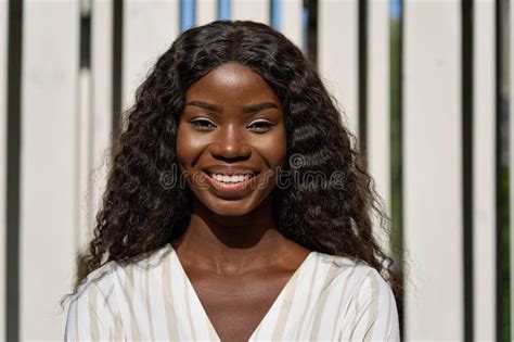 Happy Smiling Young Black African Woman Posing Outdoors For Portrait