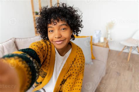 Happy African American Teen Girl Blogger Smiling Face Talking To Webcam