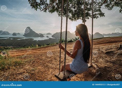 Beautiful Girl On A Swing On Vacation In Asia View Of The Phang Nga Bay Thailand Adventure
