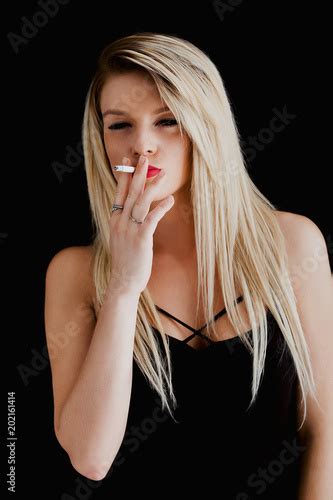 Blonde And Tough Woman Portrait Smoking Cigarette Buy This Stock