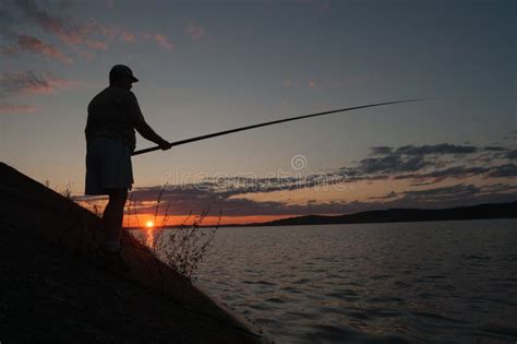 Fisherman At Sunset Stock Photo Image Of Lake Peaceful 69923494