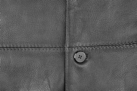 Leather Texture Close Up With A Button Part Of A Leather Jacket Stock