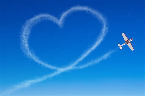 Love Figurative Heart From A White Smoke Trail Airplane Stock Photo