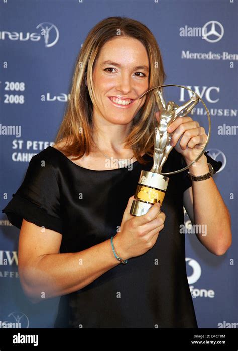 Belgian Tennis Champion Justine Henin Poses With Her Laureus World