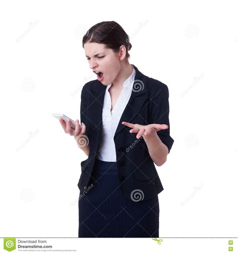 Angry Businesswoman Standing Over White Isolated Background Stock Photo