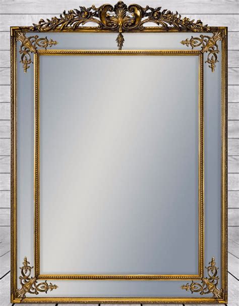 large gold decorative framed wall mirror with crest top the enid hutt gallery