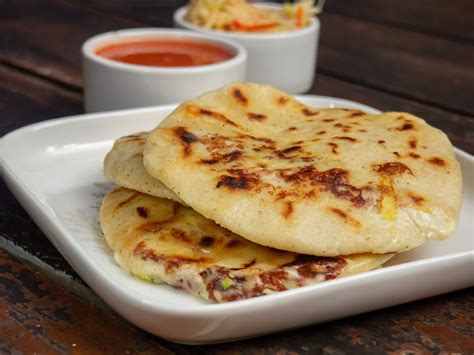 This popular el salvadorian dish was first prepared by the pipil tribes who were the country's first native peoples. Pupusas, Must-Try Salvadoran National Dish