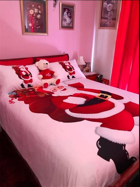 A Bedroom Decorated For Christmas With Teddy Bears On The Bed And Santa