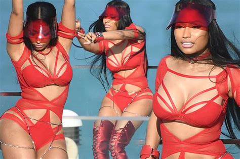 Nicki Minaj Flaunts Unreal Curves In Red Cutout Swimsuit As She Films