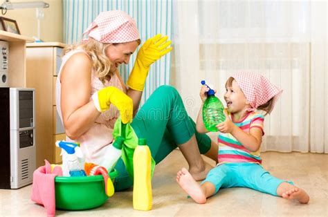 Mother With Kid Cleaning Room And Having Fun Stock Photo Image Of