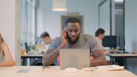 African Business Man Working On Laptop Computer At Coworking Freelance