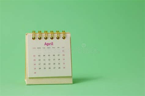 Hello Aprildesktop Calendar For April 2023 On The Table Stock Photo