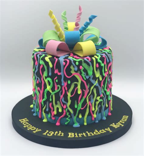 A Fluorescent Glow In The Dark Graffiti Style Drip Cake On Black