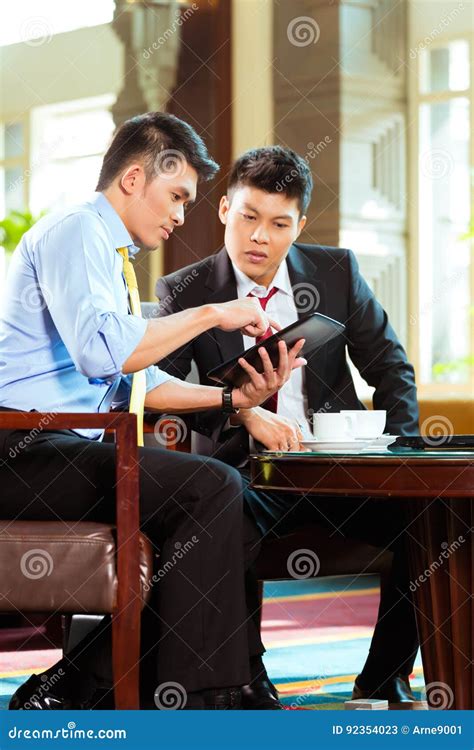 Chinese Businessmen At Business Meeting In Hotel Stock Image Image Of