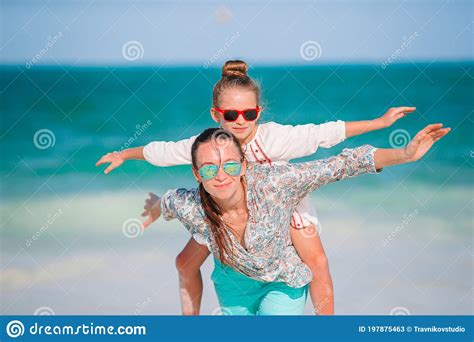 Beautiful Mother And Daughter At Caribbean Beach Enjoying Summer Vacation Stock Image Image