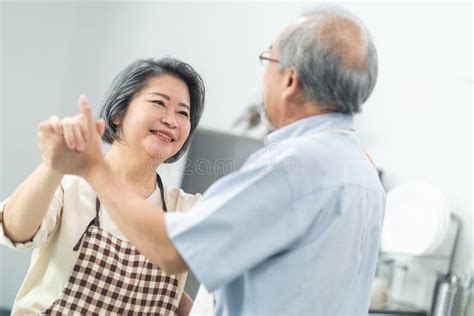 Couple Senior Asian Elder Happy Living In Home Kitchen Grandfather Hug