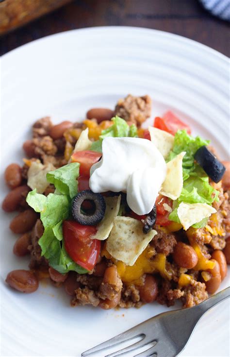 Spray a 9 x 13 pan and press the crescent rolls in bottom of the pan. Simple Taco Casserole - 5 Boys Baker