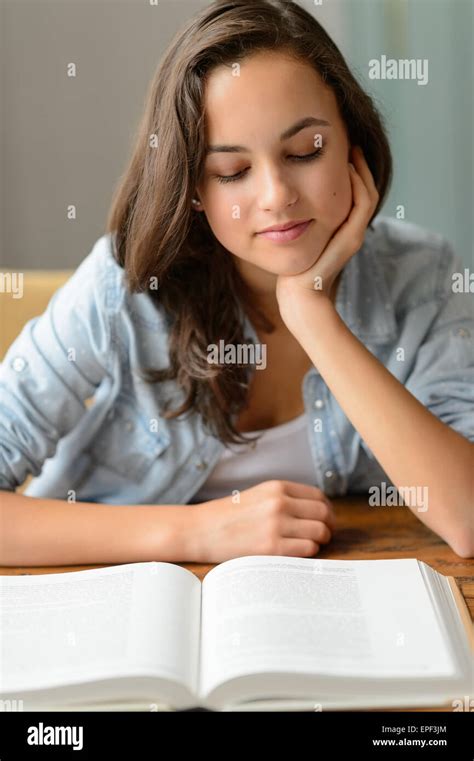 Student Teenage Girl Reading Book At Home Stock Photo Alamy