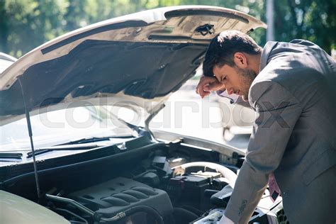 Man Looking Under The Hood Of Car Stock Image Colourbox