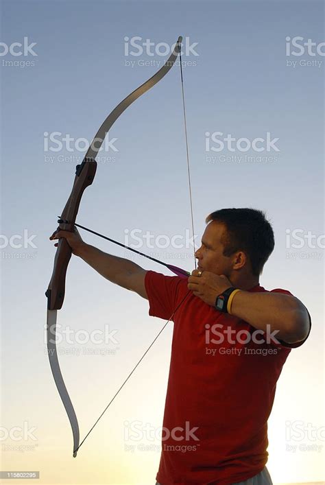 Archer Pointing His Bow And Arrow Stock Photo Download Image Now