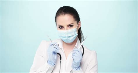 Video Of Sexy Nurse Wearing Mask On Blue 4k Stock Footage Video 8822854 Shutterstock