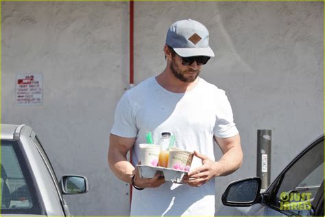 Full Sized Photo Of Chris Hemsworth Muscles Can Barely Fit In His Shirt