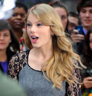 Taylor Swift Threatens Lawsuit Over Fake Topless Photo