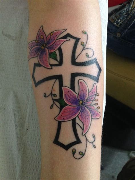 This black and white tattoo that has vines as well as smaller roses. klunk:religious-cross-cross-with-flowers-cross-tattoo ...