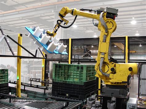 Robotic Material Handling Tending Genesis Systems