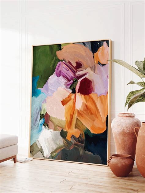 An Abstract Painting Is Displayed On The Wall Next To Two Vases And A Plant