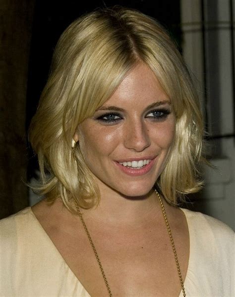 Sienna Miller With Foiled Blonde Hair Cut Into A Layered Style