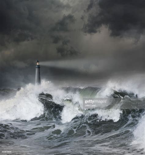 Lighthouse In Ocean Storm High Res Stock Photo Getty Images