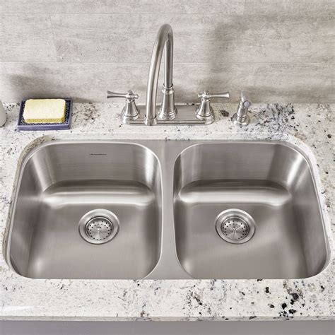 In a double bowl sink, the bridge in between the two sinks provides structural integrity and support, so a larger overall length is possible. Portsmouth 32-1/4" Double Bowl Undermount Kitchen Sink ...
