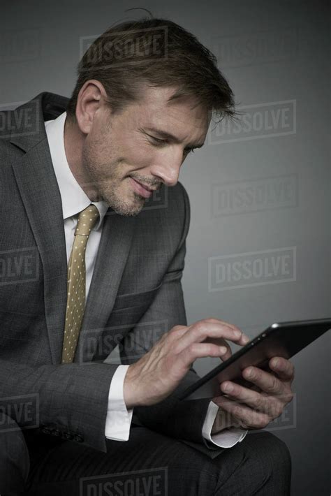 Businessman Using Digital Tablet Stock Photo Dissolve