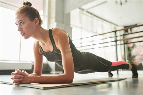 Contemporary Woman Doing Plank Exercise L Arginine Plus