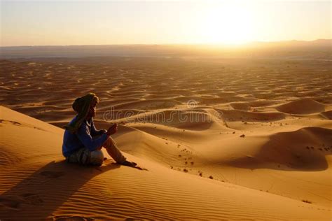 Desert Man Watching The Sun Go Down On A Sand Dune Editorial Stock