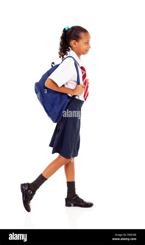 Female Elementary School Student Walking On White Stock Photo Alamy