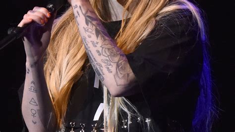 Heres What Avril Lavignes Tattoos Really Mean