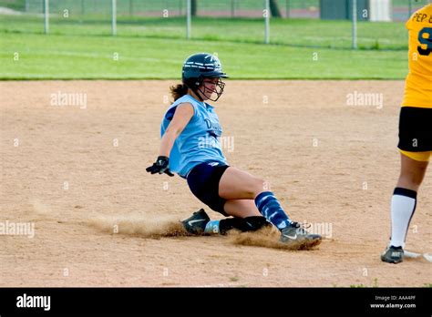 Teenage Female Softball Player Age 14 Sliding Into Base Downers Grove