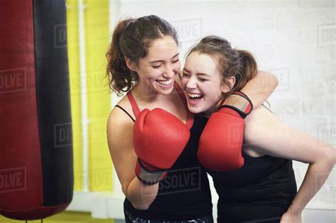 Two Female Boxing Friends Pretending To Punch In Gym Stock Photo
