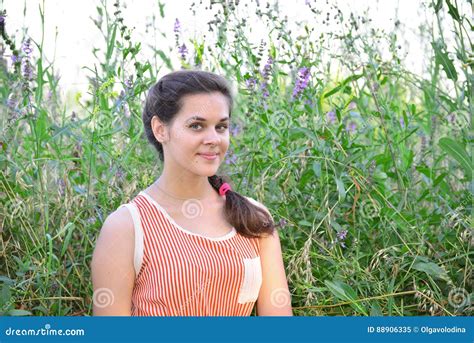 Portrait Of Beautiful Russian Girl On Background Of Blue Wildflowers Stock Image Image Of