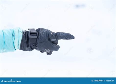 Hand In Winter Glove Gesture Pointing With Index Finger Stock Photo