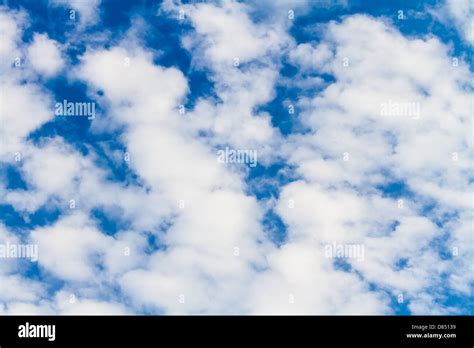 Puffy White Clouds Against A Perfect Blue Sky Stock Photo Alamy