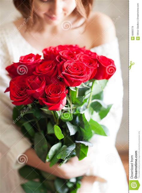 Beautiful Girl With Big Red Roses Bouquet Stock Image
