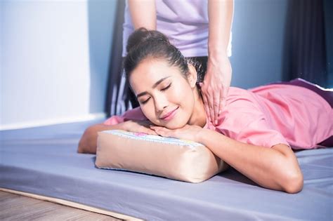 premium photo thai back and shoulder massage to woman