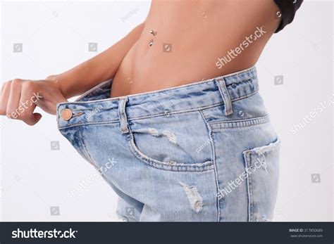 Woman Shows Weight Loss By Wearing Stock Photo 317850689 Shutterstock