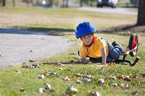 Child Falling Off Bike Stock Photos Pictures And Royalty Free Images