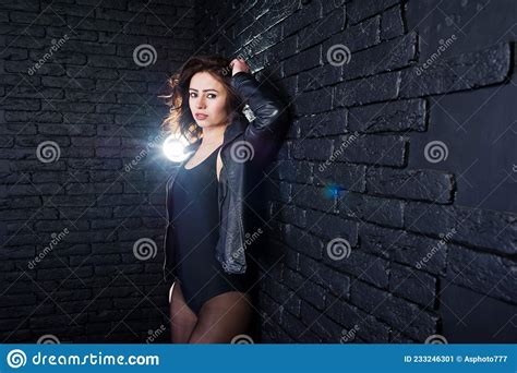 Studio Portrait Of Brunette Girl In Black Leather Jacket Stock Image