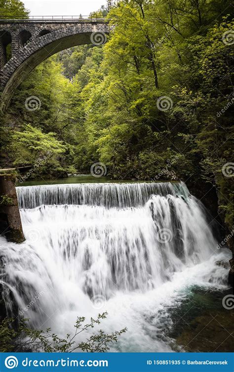 Beautiful Scenic Vintgar Gorge With Stone Bridge Arch Above Waterfall